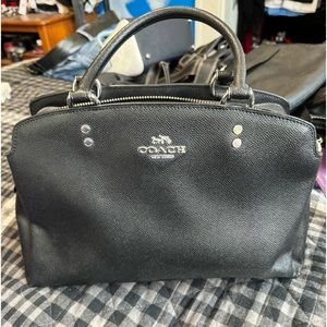 Coach medium size hand bag. Gently used. No rips or tears or stains.